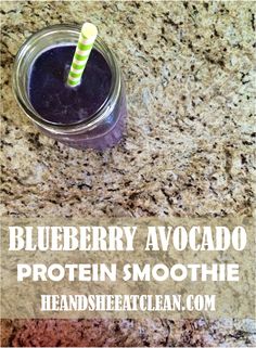 blueberry avocado protein smoothie in a mason jar with a green striped straw