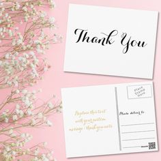 two thank cards with the words, thank you and gold foil on them next to some baby's breath flowers