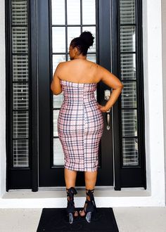 This fun, colorful fitted dress hugs every single curve in the right places sis. Adorned with a houndstooth print and colors of pinks and blue, the look is effortless. Simple, yet elegant at the same time. This fitted piece is waiting for you sis. S (6-8), M (8-10), L (10-12), 1X (14-16), 2X (16-18), 3X (18-22) Stretch dress Strapless Midi dress Bodycon Fit 89% Polyester 11% Spandex Hand wash cold Model is wearing 2X, 5'9" height. True to size but if you like a less fitted look, size up. 9.13.24 Plaid Mini Dress With Houndstooth Pattern For Party, Fitted Plaid Midi Dress For Day Out, Chic Plaid Dress For Night Out, Fitted Plaid Dress For Night Out, Fitted Houndstooth Dress For Night Out, Fitted Sleeveless Plaid Party Dress, Spring Plaid Dress For Night Out, Plaid Dress For Night Out In Spring, Fitted Pink Plaid Dress For Spring