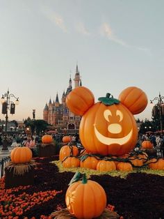 mickey mouse pumpkins in front of the castle