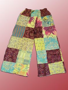 Introducing our Wevez Patchwork Pants, perfect for any casual occasion. These pants come in a beautiful red and yellow pattern and are made of high-quality cotton fabric with a drawstring closure and elastic waist for a relaxed fit. The wide-leg style and patchwork accents give these pants a unique hippie boho vibe, making them a great addition to any wardrobe. These one-size-fits-all pants are suitable for women of all sizes and are perfect for yoga, urban outings, or just lounging at home. The palazzo style adds to the comfortability of the pants while the cotton material provides breathability and durability. Get your hands on these stylish pants from the trusted brand Wevez today! Patchwork Pants, Palazzo Style, Boho Yoga, Festival Pants, Stylish Pants, Yellow Pattern, Red And Yellow, Boho Vibe, Trousers Women