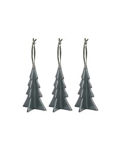 three metal christmas trees sitting next to each other