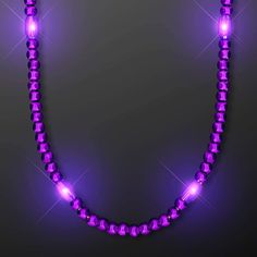 a purple necklace with glowing lights on it