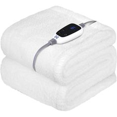 an electric heated towel is shown on top of two white towels with thermometer attached to it