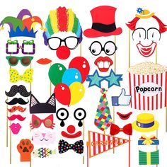 an assortment of photo booth props including clowns, hats, and glasses on sticks