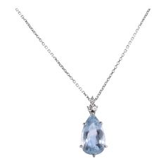 This is part of Chairish’s Fine Jewelry assortment.  Estate pear aquamarine white gold pendant necklace. This 14 karat white gold pendant features a pear aquamarine at 7.75 carats. The aquamarine is clean and nicely cut. There are three accent diamonds at .11 carat total weight. The diamonds have VS clarity and G-H color. The aquamarine pendant comes on a 14 karat white gold chain. [KIMH 2141 P]  Dimensions  1″H x .4375″W; 16″L chain  Metal: White Gold,14k Gold Stone: Aquamarine,Diamond Stone Cu Formal Blue Topaz Drop Necklace, Pear-shaped Blue Topaz Necklace, Formal Blue Topaz Teardrop Pendant Necklace, Formal Teardrop Blue Topaz Necklace, Formal Blue Topaz Teardrop Necklace, Blue Topaz Teardrop Necklace For Formal Occasions, Elegant Blue Topaz Teardrop Pendant Necklace, Elegant Blue Topaz Teardrop Necklace, White Gold Pendant Necklace