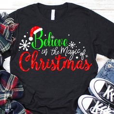 believe in the magic of christmas t - shirt with santa hat and snowflakes