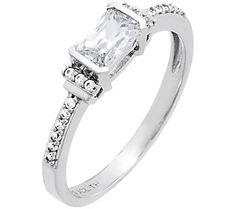 a white gold ring with a princess cut diamond set in the center and side stones