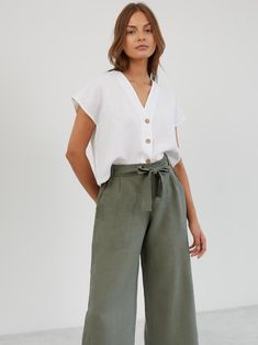 ALLIE is a pair of relaxed-fit, wide-leg cropped linen pants. They feature a high-waisted paper bag design with a self-tie belt, offering both comfort and style for a variety of occasions. DETAILS - High-rise paperbag waist - Wide-leg cut for a relaxed, flowy fit - Cropped length - Pleated front COLOR - Sage Green (featured color) - Multiple colors available in dropdown menu above - See all color options & order fabric samples here: https://www.etsy.com/listing/586569696/linen-fabric-samples SIZ Green Linen Pants, Paper Bag Design, Linen Wide Leg Pants, Pants Linen, Linen Pant, Cropped Linen Pants, Linen Crops, Uniform Fashion, Wide Leg Linen Pants