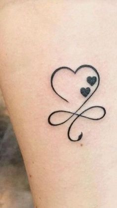 a heart tattoo with two hearts on it