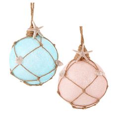 two ornaments hanging from twine with rope and starfish on the top one is light blue and pink