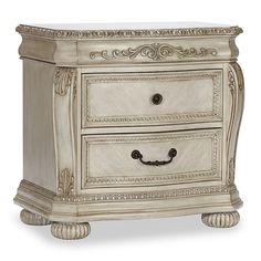 an antique style nightstand with two drawers and ornate carvings on the front, in white