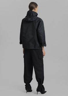 Color: Black Unisex style Lightweight technical fabric with slight sheen Relaxed silhouette Adjustable toggle drawstrings for hood Twisted detailing at front Snap button cuffs Kangaroo patch pocket with velcro Concealed toggle drawstrings at hem Quarter snap button closure Slip on Unlined 100% Polyamide Gentle Machine Wash By Coperni. Made in Italy Model is 174cm/5'8" wearing size S Black Utility Jacket With Adjustable Hood For Streetwear, Black Urban Hooded Utility Jacket, Black Windbreaker With Cargo Pockets For Fall, Black Cargo Pockets Windbreaker For Fall, Black Fall Windbreaker With Cargo Pockets, Black Fall Parka With Cargo Pockets, Fall Black Parka With Cargo Pockets, Black Hooded Outerwear With Cargo Pockets, Black Hooded Jacket With Cargo Pockets For Winter