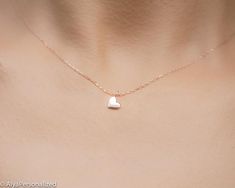 14k solid gold heart necklace;  a tiny heart! It is a wonderful gift for her which will be with her for a life time because of the real gold material...Elegant and minimalist  ♡► FEATURES;Material Options: 14K White Gold/ Rose Gold / Yellow GoldLength : Standart length is 16''+0.5'' extention chain (The necklace on the photo is also 16'' in length).❥ I can adjust necklace length to your demands, please add me a note during check out if you wish a different necklace length.► HOW TO ORDER;Please s Minimalist 14k Gold Heart Necklace For Anniversary, Dainty 14k Gold Charm Necklace For Anniversary, Tiny Simple Charm Necklace As Gift, Dainty Charm Necklaces With Simple Design For Gifts, Simple Tiny Charm Necklaces For Gifts, Simple Tiny Charm Necklaces As Gift, Simple Tiny Charm Necklace For Gift, Minimalist Heart Cut Charm Necklace As Gift, Minimalist Heart Charm Necklace For Anniversary Gift