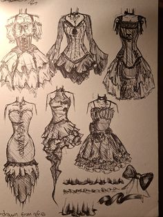 several sketches of dresses on display in a museum