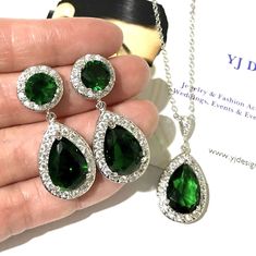 "A classic emerald green bridal jewelry set featuring teardrop cz earrings and pear drop necklace pendant made of cubic zirconia teardrops and brilliant cz, hanging onto white gold silver rhodium plated posts, bail and chain. Earrings measure about 1 3/8\" (3.5cm) long including posts. Pendant is 1 1/4\" (3.1cm). Chain length can be added with a 2\" extender chain. View matching, similar design and other color options at https://etsy.me/2XN9lO3 * Pics on mannequin in clear cz silver base is for May Birthstone Teardrop Jewelry For Parties, Green Teardrop Jewelry Sets For Anniversary, Green Drop Jewelry For Wedding, Green Teardrop Earrings For Wedding, Green Teardrop Bridal Earrings For Wedding, Emerald Drop Jewelry For Weddings, Green Teardrop Dangle Earrings For Wedding, Green Teardrop Wedding Earrings, Emerald Drop Wedding Jewelry