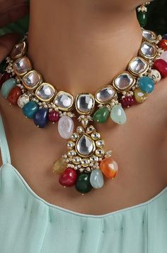 This navrattan necklace set with its pop of colors and quirky shapes is a sublime piece. The subtelty of the polki with hints of muted golden tones creates the perfect balance to create a winning look. Necklace Closure - Adjustable Dori Earrings Closure - Push Back Style Tip - This multicolored piece of art is perfect for gracing traditional funtions in full pomp and show. Navrattan itself being the traditional epitome of prosperity, wealth and status. What could be better than Handcrafted in Ja Multicolor Necklaces For Festivals And Celebrations, Traditional Colorful Jewelry For Festivals, Multicolor Temple Jewelry Necklace As Gift, Multicolor Temple Jewelry Necklace For Gift, Multicolor Temple Jewelry Necklaces For Gift, Multicolor Necklaces For Festive Gifts, Festive Multicolor Beaded Jewelry, Multicolor Handmade Kundan Necklace For Party, Handmade Multicolor Kundan Necklace For Party