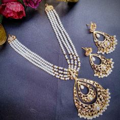 pearl necklace set tanishq 22k Gold Pearl Necklace For Celebrations And Festivals, Bollywood Chandbali Pearl Necklace For Festive Occasions, Bollywood Style Chandbali Pearl Necklace For Festive Season, Bollywood Style Chandbali Pearl Necklace For Festive Occasions, Temple Jewelry Pearl Chandbali Sets, Hand Set Chandbali Pearl Necklace For Diwali, Bridal Chandbali Necklace With Pearl Drop, Festive Chandbali Pearl Bridal Necklace, Diwali Chandbali Pearl Necklace With Intricate Design