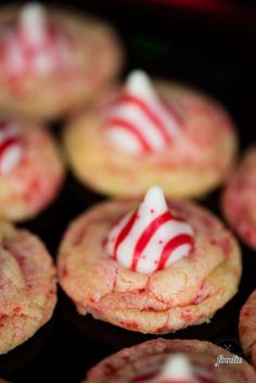 red and white candy cane cookies sitting on top of each other