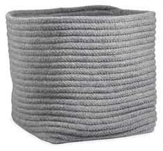 a large gray rope basket on a white background