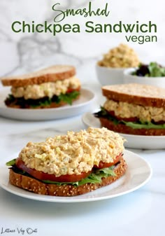 Three plates with only front on in focus which has open face sandwich of grainy bread, lettuce, tomato and mashed chickpea salad. Other plates with sandwiches plus two bowls in far back filled with chickpea salad and lettuce. Green text at top reads "Smashed Chickpea Sandwich vegan" Smashed Chickpea Salad, Vegan Chickpea Salad, Quick Vegan Breakfast, Smashed Chickpea, Chickpea Sandwich, Salad Sandwich Recipe, Chickpea Salad Sandwich, Quick Lunch Recipes, Quick Vegan Meals