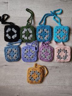 small crocheted purses are sitting on the floor