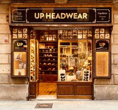 an up headwear store front with shoes on display