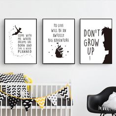 three black and white posters on the wall above a crib in a baby's room