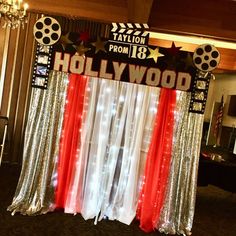 hollywood themed backdrop with red, white and blue drapes