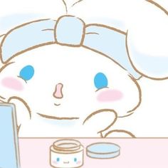 a drawing of a little bunny sitting at a desk with a laptop and jar of peanut butter