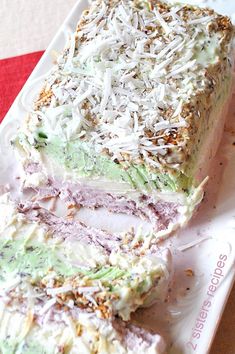 a close up of a cake on a plate with sprinkles and shredded cheese