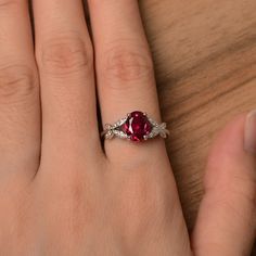 It is a lab ruby ring. The main stone is 7 mm*9 mm oval cut.weight about 2.32 carats. The basic metal is sterling silver and plated with rhodium. To change the metal to a solid gold (white/rose) or platinum is also available, please ask for a quotation if you want. You can also go to my shop Home for more elegant rings: https://www.etsy.com/shop/godjewelry?ref=hdr_shop_menu Ruby is July birthstone. More ruby rings: https://www.etsy.com/shop/godjewelry?section_id=20709238 Customization is always Oval Lab-created Ruby Promise Ring, Oval Ruby Birthstone Jewelry, Oval Lab-created Ruby Jewelry In White Gold, Oval Lab-created Ruby In White Gold Jewelry, White Gold Oval Lab-created Ruby Jewelry, Oval Ruby Birthstone Ring In White Gold, White Gold Oval Ruby Birthstone Ring, Oval Ruby Solitaire Jewelry, Oval Ruby Ring With Prong Setting In Sterling Silver