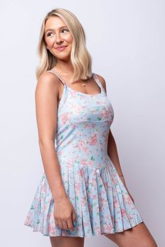 Stay active in style with our Astoria Active Dress. Designed with activewear in mind, this dress features a fun and feminine pink floral pattern and a flattering short pleated skirt. Wash Cold Shell: 95% Polyester | 5% Spandex Skirt: 100% Polyester Fit Guide: Trinity is 5ft 2 inches; Bust 32”, Waist 24”, Hips 33” Model is wearing a size small True to size *available at our envy location Blue Floral Print Dress By Urban Outfitters, Urban Outfitters Summer Mini Dress With Floral Print, Urban Outfitters Blue Floral Print Dress, Summer Blue Mini Dress With Built-in Bra, Short Pleated Skirt, Urban Outfitters Floral Beach Mini Dress, Active Dress, Pleated Skirt Short, Katie May