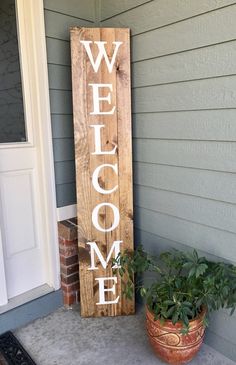 a wooden sign that says welcome on it