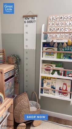 a child's room with bookshelves and toys on the floor in front of it