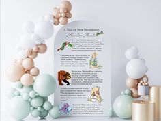 balloons and decorations are arranged around a paper scroll