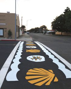 an empty parking lot with painted designs on it