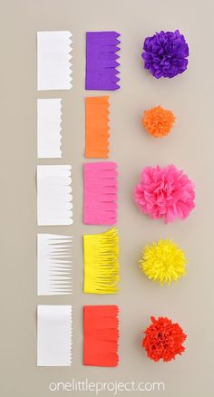 paper flowers are arranged on top of each other in order to make the flower petals