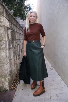 Constructed in panels of buttery lambskin leather, our mid-rise skirt flares out into a flattering A-line silhouette. Concealed zip closure. Side-seam pockets. Half lined. Professional clean only. 100% Lambskin leather. Lining: 100% Polyester. Sleek Leather Midi Skirt, Spring Knee-length Leather Skirt, Classic Knee-length Leather Skirt, Relaxed Knee-length Leather Skirt, Sleek Knee-length Faux Leather Skirt, Ag Jeans, Eileen Fisher, Ulla Johnson, Denim Pant