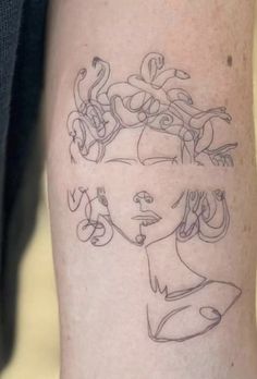 a woman's arm with some drawings on it