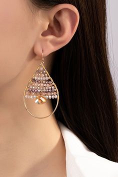 Make a statement with these funky Faceted Glass Beaded Teardrop Earrings! The wire-wrapped beads add a touch of whimsy to the classic teardrop shape, while the fishhook earwires make them easy and comfortable to wear. Perfect for any fashion-forward individual looking to add a fun pop of color to their outfit. size: 2.5"ships from USA Teardrop Beaded Earrings With Ear Wire For Party, Wire Wrapped Teardrop Earrings For Party, Beaded Teardrop Earrings For Summer, Party Teardrop Beaded Earrings With Ear Wire, Party Teardrop Beaded Metal Earrings, Summer Beaded Teardrop Earrings, Summer Teardrop Beaded Earrings, Beaded Metal Teardrop Chandelier Earrings, Summer Dangling Bead Teardrop Earrings