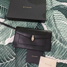 Gorgeous, Luxury, Elegant, Sophisticated Wallet Can Be Used As A Mini Handbag Too! Brand New Unworn Comes With Original Box And Certificates. The Box Has Some Darker Stains As In Photo Purse Is Absolutely New And The Perfect Christmas Gift To A Loved One Or To Yourself! #Bvlgari #Bulgari #Serpenti #Christmasgift #Luxury #Brandnew Luxury Black Clutch With Palladium Hardware, Luxury Business Clutch With Magnetic Closure, Elegant Envelope Wallet With Magnetic Closure, Elegant Leather Wallet With Palladium Hardware, Elegant Leather Envelope Wallet, Elegant Leather Wallets With Palladium Hardware, Elegant Envelope Leather Wallets, Luxury Black Wallets For Formal Occasions, Luxury Envelope Clutch For Formal Occasions