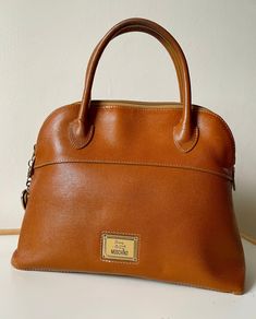 🧿Vintage 🧿Authentic 🧿size 32x24x11 🧿got sign of usage 🧿comes with replacement dustbag 🧿NOT FOR FUSSY BUYER PLS. Brown Handheld Satchel For Formal Occasions, Formal Brown Handheld Satchel, Brown Double Handle Satchel For Formal Use, Classic Light Brown Satchel With Double Handle, Formal Brown Satchel, Elegant Dark Tan Satchel Bags, Brown Office Satchel, Classic Light Brown Double Handle Satchel, Handheld Brown Satchel For Office