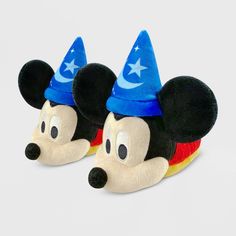 After a long day of spellcasting gone awry, your sorcerer's apprentice can lower the broom and recharge spent powers in these soft, cozy slippers with a plush Mickey head and magic hat. Features fuzzy fabric and soft fill. Elastic upper with heel pull for easy on and off. Genuine, Original, Authentic Disney Store Product. Size: 5-6. Color: blue/red. Gender: unisex. Age Group: kids. Pattern: Solid. Minnie Mouse House, Slippers Kids, Sorcerer Mickey, Boys Slippers, Toddler Slippers, Disney Shoes, Woody Toy Story