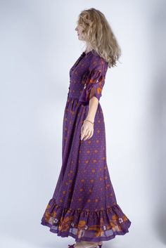 SIZE: fits EU 38, UK 12, USA 8, general size M. MATERIAL: 100% Trevira sheer. COLOR: purple, orange, white. FEATURES: this stunning vintage 70's boho chic lightweight maxi dress from Finland's brand Merry Finn in floral hippie pattern features ruffled bell sleeves and bottom, material covered buttons up the front. Fully lined except sleeves. The outer fabric is sheer and there is an option to shorten the lining to a desired length to show those beautiful leg contours. Perfect for summer to pair Ruffle Bell Sleeve, 70s Boho, 70s Dress, Dress Purple, Purple Orange, Hippie Bohemian, Orange White, Purple Floral, Purple Dress