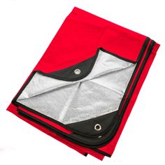 an open red and black bag sitting on top of a white surface