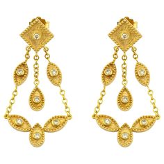 Luxury Gold Drop Danglers, Luxury Yellow Gold Drop Chandelier Earrings, Luxury Yellow Gold Chandelier Drop Earrings, Elegant Yellow Gold Chandelier Earrings With 17 Jewels, Luxury Dangle Chandelier Earrings, Luxury Yellow Gold Teardrop Chandelier Earrings, Luxury Pierced Dangle Chandelier Earrings, Luxury Gold Drop Chandelier Earrings, Luxury Drop Chandelier Earrings With Intricate Design