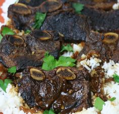 some meat and rice on a plate with parsley