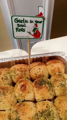 garlic bread rolls in tin foil with a sign on the top that says garlic in your rolls