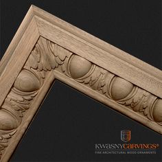 an ornate carved wooden frame on a black background